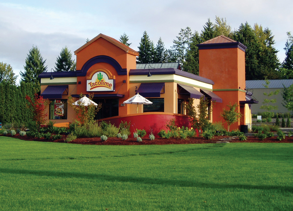 exterior of TacoTime with a green lawn 